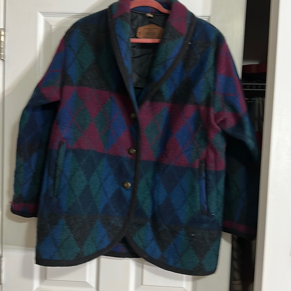 Vintage Woolrich coat has old school shoulder pads and made of 80% wool